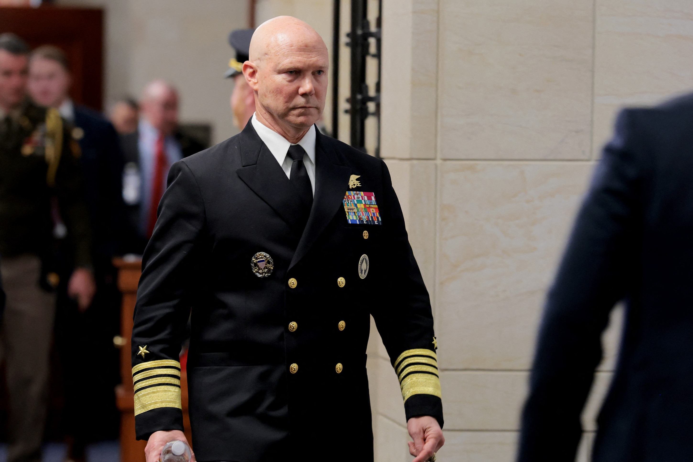  WASHINGTON, DC - DECEMBER 04: Navy Adm. Frank Bradley walks to a hold room in between attending closed-door classified meetings with lawmakers on Capitol Hill on December 4, 2025 in Washington, DC. Members of the Senate and House Armed Services committees met with Bradley about the strikes on suspected drug boats out of Venezuela ordered by the Trump Administration.   Anna Moneymaker/Getty Images/AFP (Photo by Anna Moneymaker / GETTY IMAGES NORTH AMERICA / Getty Images via AFP)       