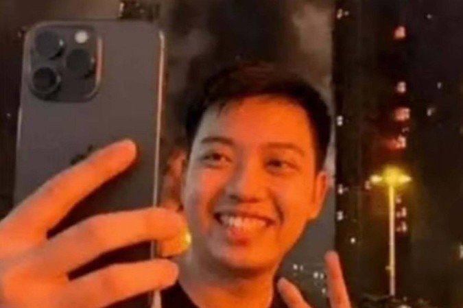 Influenciador é preso após postar selfie em incêndio em Hong Kong