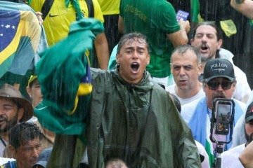 Chegada de Nikolas a Brasília foi marcada por fortes chuvas - (crédito: Sergio LIMA / AFP) Chegada de Nikolas a Brasília foi marcada por fortes chuvas - (crédito: Sergio LIMA / AFP)