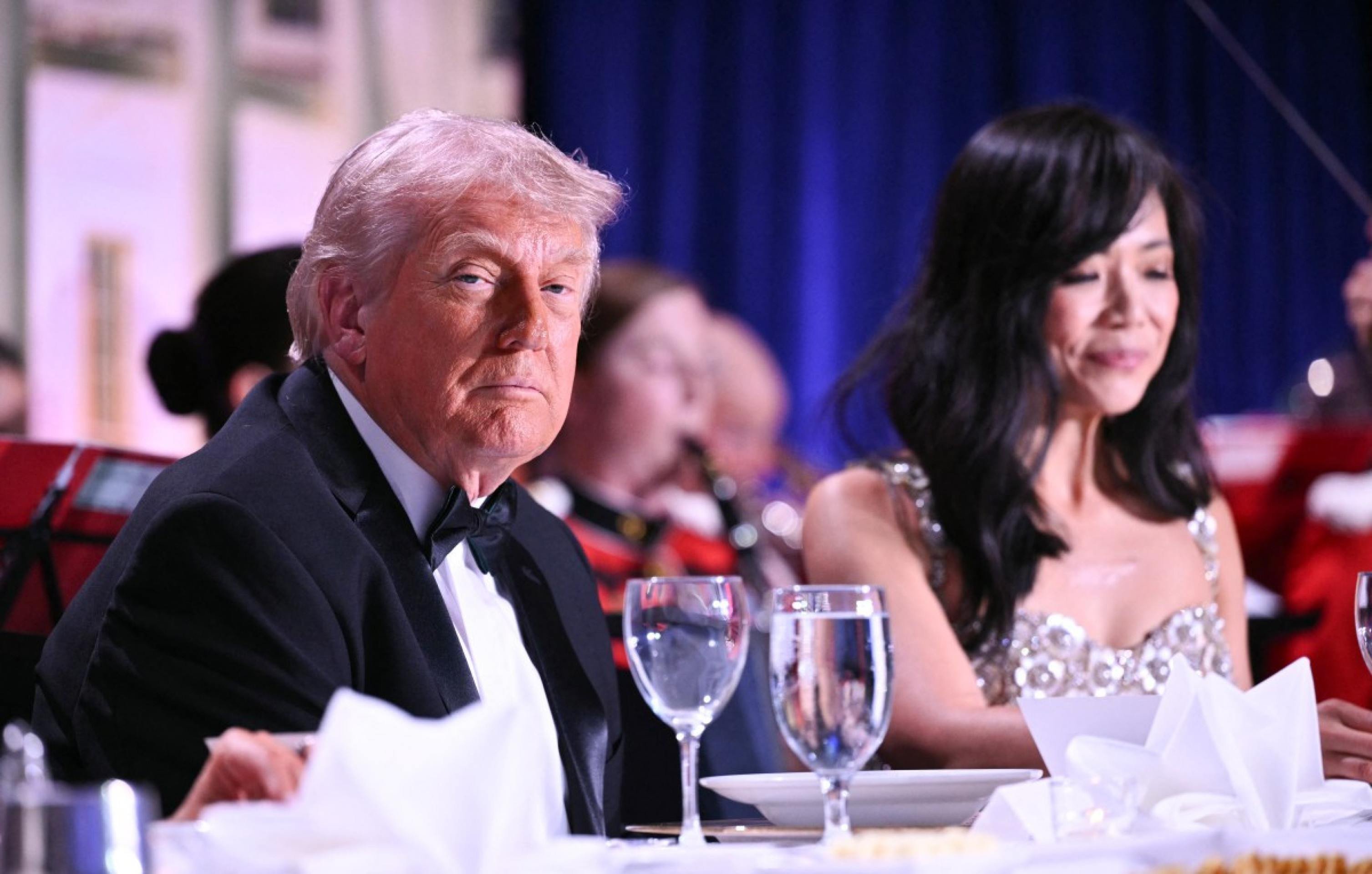  US President Donald Trump and CBS News senior White House correspondent Weijia Jiang speak as they attend the White House Correspondents' dinner at the Washington Hilton in Washington, DC, on April 25, 2026. President Trump is attending the annual gala of the political press for the first time while in office. (Photo by Mandel NGAN / AFP)
      