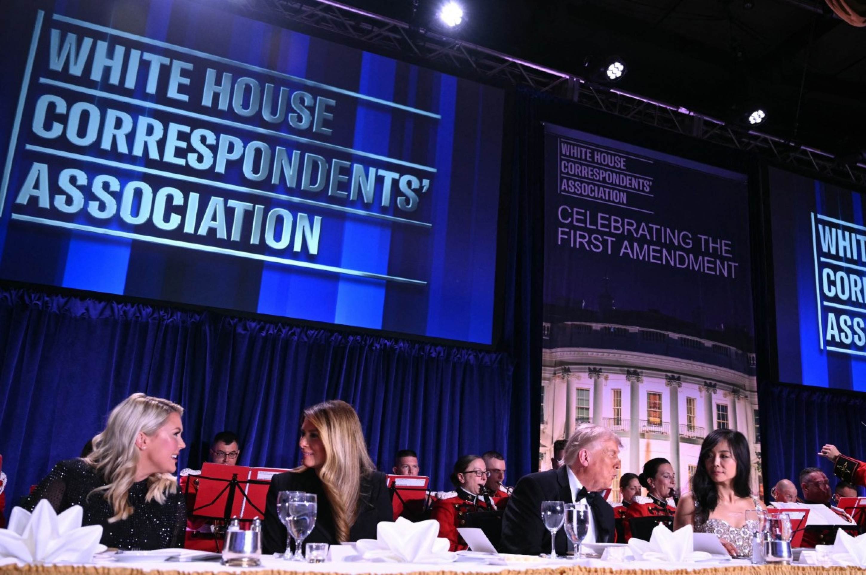  (L/R) White House Press Secretary Karoline Leavitt, US First Lady Melania Trump, US President Donald Trump and CBS News senior White House correspondent Weijia Jiang attend the White House Correspondents' dinner at the Washington Hilton in Washington, DC, on April 25, 2026. President Trump is attending the annual gala of the political press for the first time while in office. (Photo by Mandel NGAN / AFP)
      Caption 