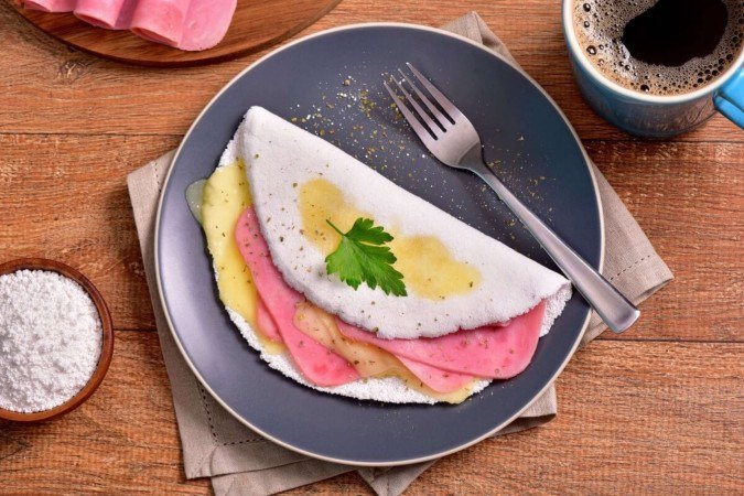 Tapioca de presunto e queijo (Imagem: Marcelo_Krelling | Shutterstock) - (crédito: EdiCase) Tapioca de presunto e queijo (Imagem: Marcelo_Krelling | Shutterstock) - (crédito: EdiCase)