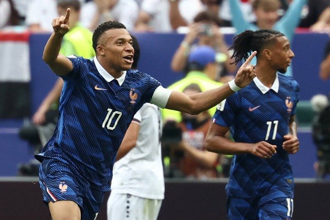 Kylian Mbappé e Michael Olise, da França, durante partida da Copa 2026: ambos seguem como recordistas - (crédito: FRANCK FIFE / AFP) Kylian Mbappé e Michael Olise, da França, durante partida da Copa 2026: ambos seguem como recordistas - (crédito: FRANCK FIFE / AFP)