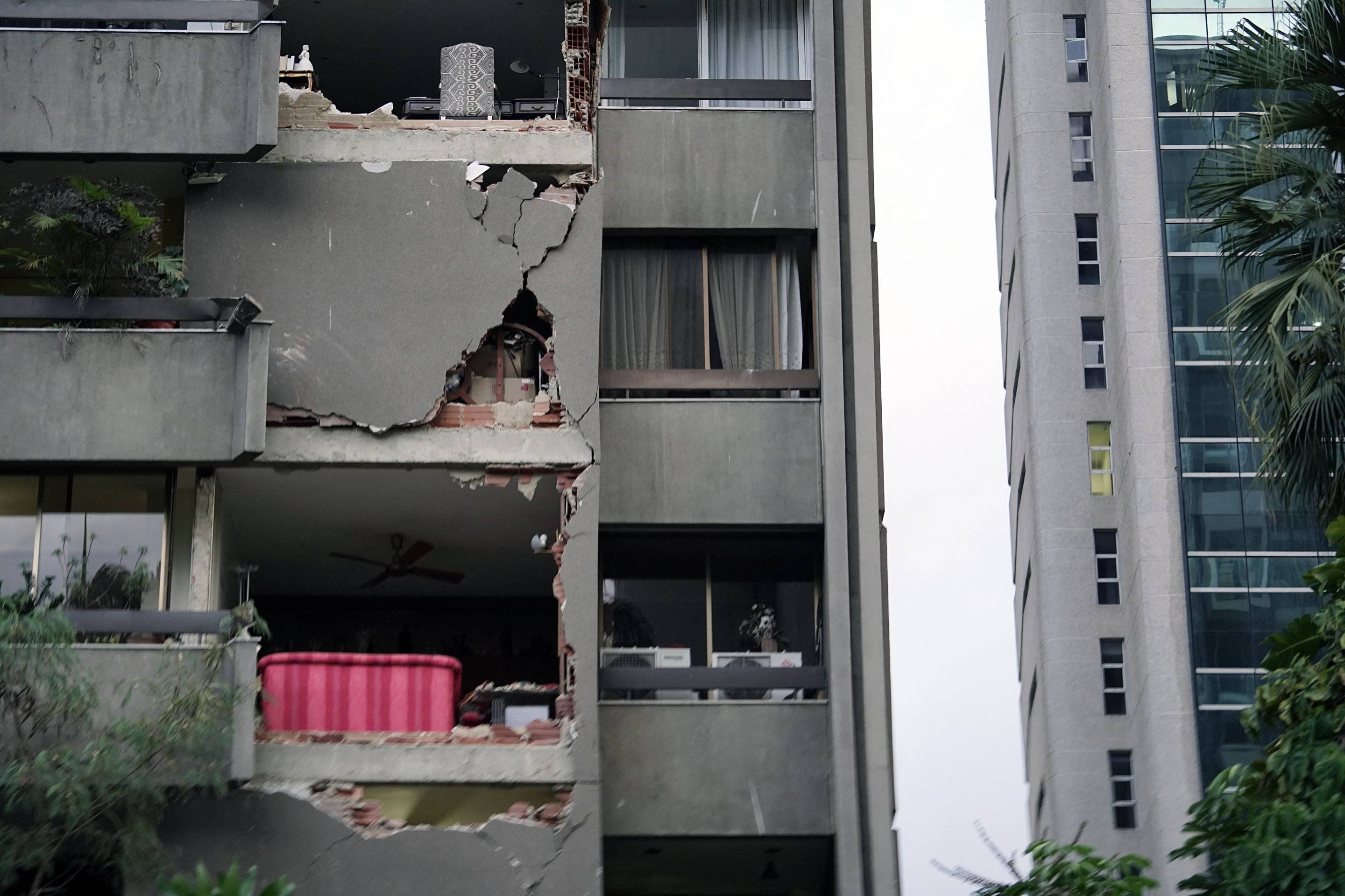  A damaged apartment building is seen following an earthquake in Caracas on June 24, 2026. A magnitude 7.1 earthquake struck Venezuela on Wednesday, the United States Geological Survey (USGS) reported, triggering panic in Caracas, according to AFP journalists. The tremor, which was followed by several aftershocks, was also felt in Colombia. (Photo by Manaure Quintero / AFP)       Caption 