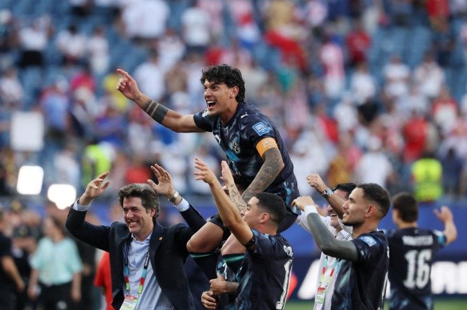 Jogadores paraguaios celebram classificação histórica diante da Alemanha na Copa do Mundo de 2026       -  (crédito: Odd Andersen/AFP)