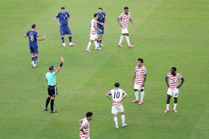 Referee Raphael Claus shows Folarin Balogun #20 of the United States a red card for a foul on Tarik Muharemovic #4 of Bosnia and Herzegovina during the FIFA World Cup 2026 Round of 32 match between USA and Bosnia and Herzegovina at San Francisco Bay Area Stadium on July 01, 2026 in Santa Clara, California.