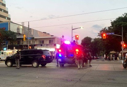 Emergency Task Force vehicles and police officers are seen on the site of a shooting in Toronto, Canada on July 11, 2026. Police in Toronto were searching Saturday night, July 11, for an active shooter who had killed two people and wounded three in an area lined with shops and restaurants. 