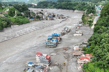 Vista aérea de casas no distrito de Nuwakot, no Nepal, após enchentes e deslizamentos - (crédito: Arun SANKAR / AFP) Vista aérea de casas no distrito de Nuwakot, no Nepal, após enchentes e deslizamentos - (crédito: Arun SANKAR / AFP)