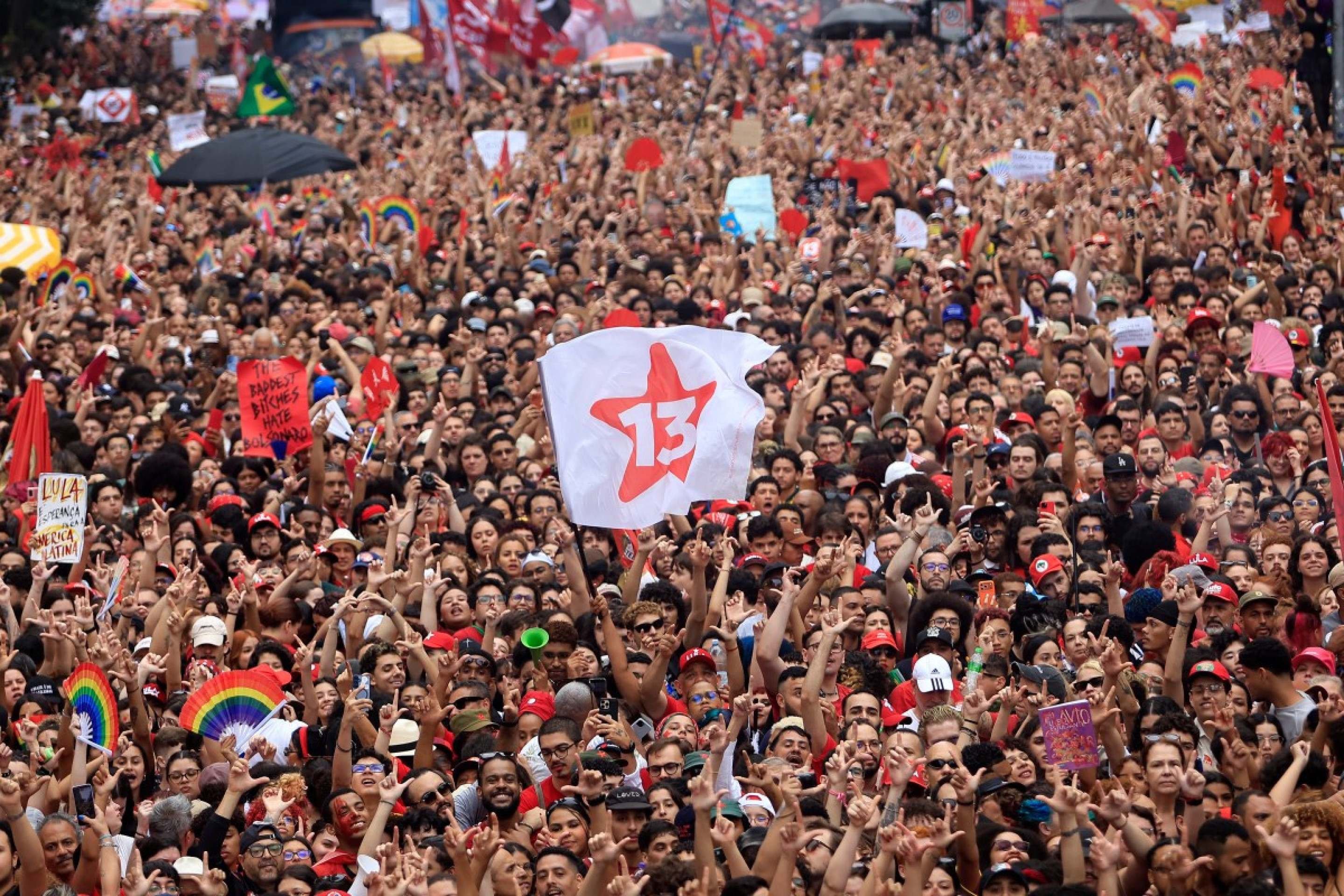  Supporters of Brazils President and presidential candidate Luiz Inacio Lula da Silva of the Workers Party (PT) attend a campaign rally in Sao Paulo, Brazil, on October 11, 2026, ahead of the presidential runoff election. (Photo by Miguel SCHINCARIOL / AFP)       