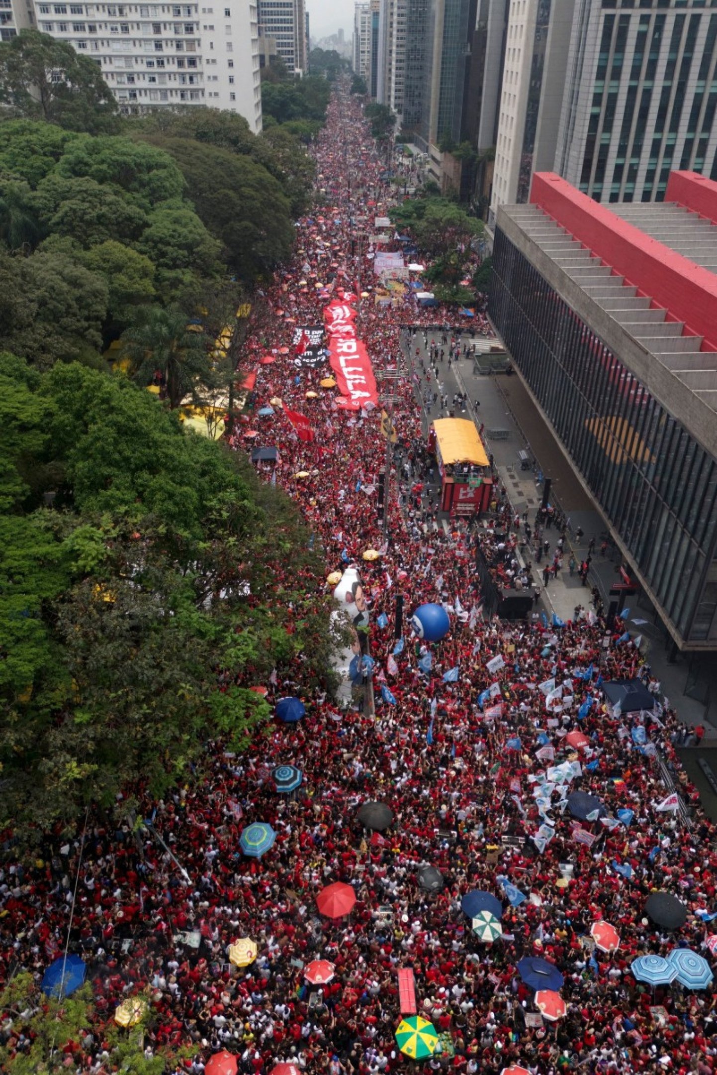  This aerial view shows supporters of Brazils President and presidential candidate Luiz Inacio Lula da Silva of the Workers Party (PT) attending a campaign rally in Sao Paulo, Brazil, on October 11, 2026, ahead of the presidential runoff election. (Photo by Miguel SCHINCARIOL / AFP)       