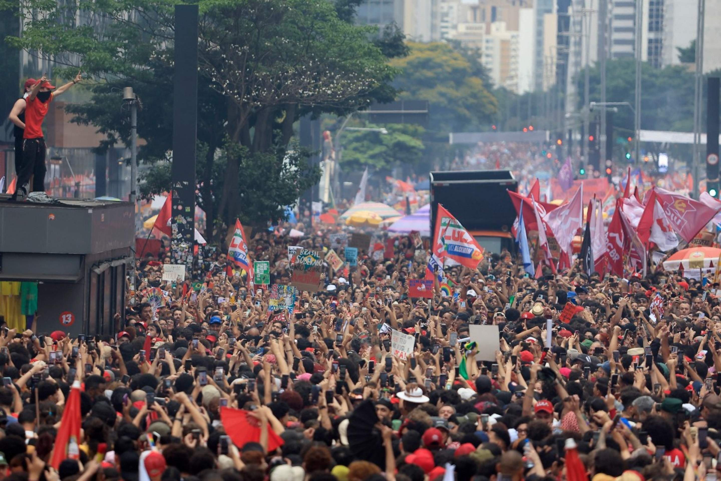  Supporters of Brazils President and presidential candidate Luiz Inacio Lula da Silva of the Workers Party (PT) attend a campaign rally in Sao Paulo, Brazil, on October 11, 2026, ahead of the presidential runoff election. (Photo by Miguel SCHINCARIOL / AFP)       